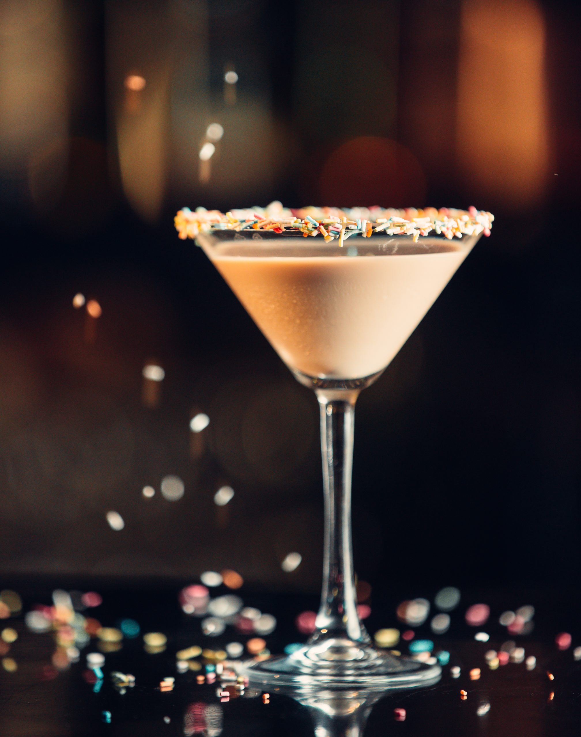 chocolate martini drink in martini glass decorated with sprinkles scaled