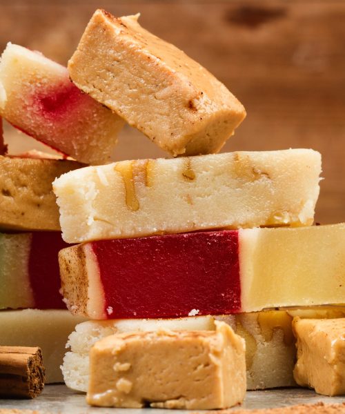 sweet-nougat-in-pieces-on-wooden-background